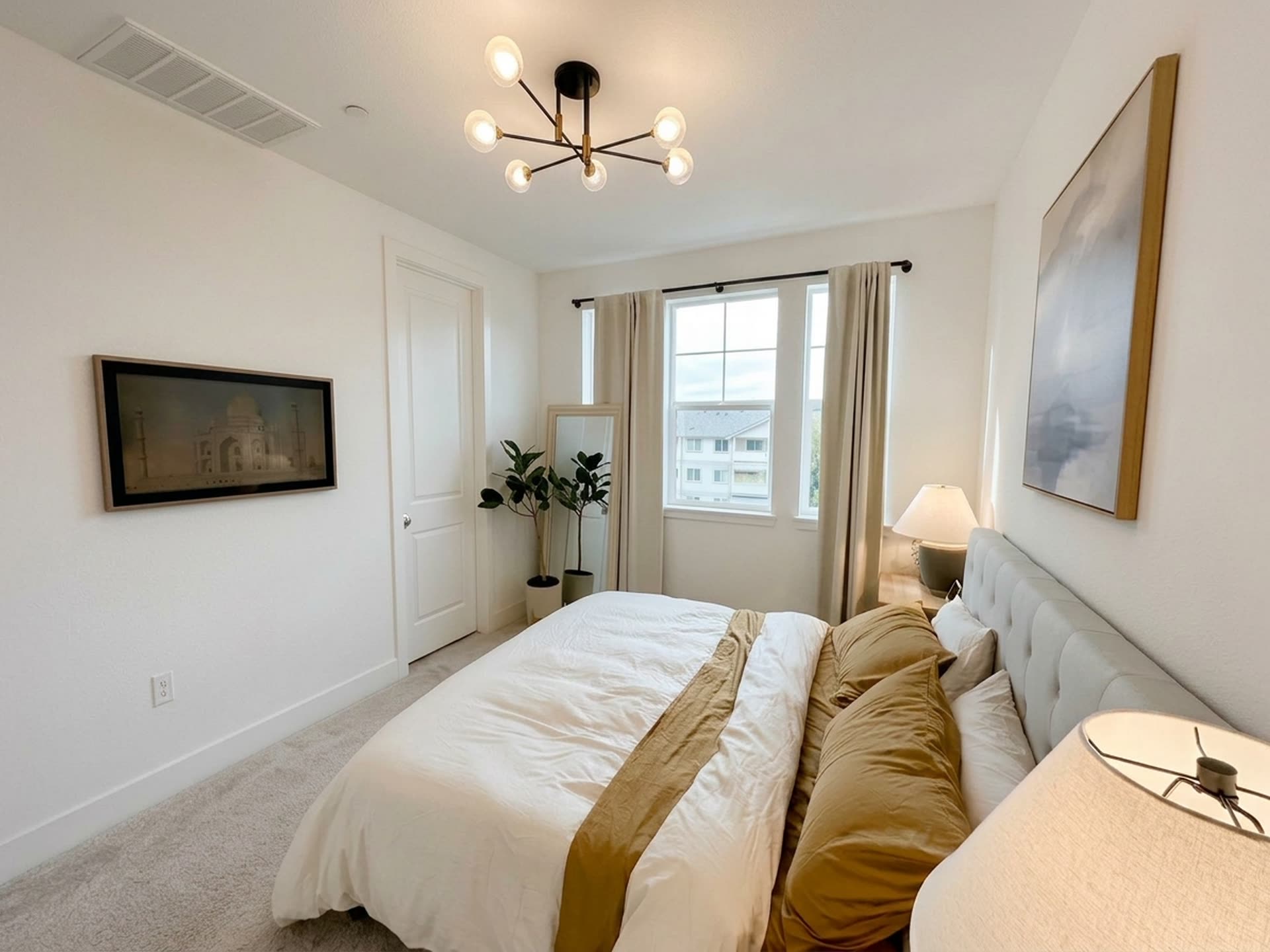 A guest bedroom, quiet and neutral toned.